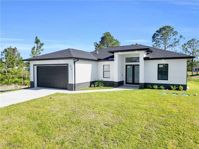 2815 32nd St W, Lehigh Acres, FL 33971 - prairie-style house featuring french doors, stucco siding, an attached garage, and driveway