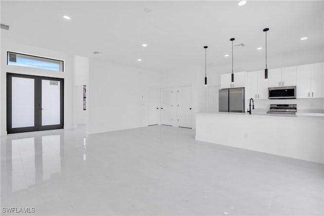 2815 32nd St W, Lehigh Acres, FL 33971 - unfurnished living room with a sink and recessed lighting