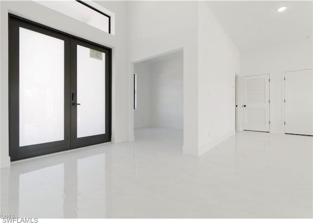 2815 32nd St W, Lehigh Acres, FL 33971 - foyer entrance featuring french doors, tile patterned floors, and recessed lighting