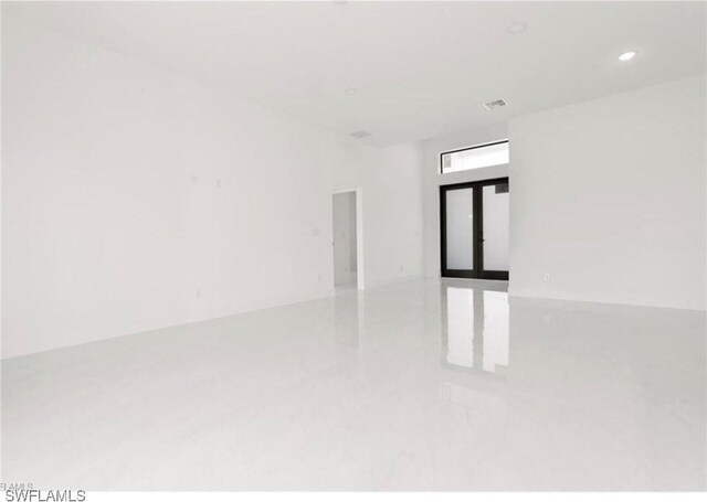2815 32nd St W, Lehigh Acres, FL 33971 - unfurnished room featuring french doors and recessed lighting