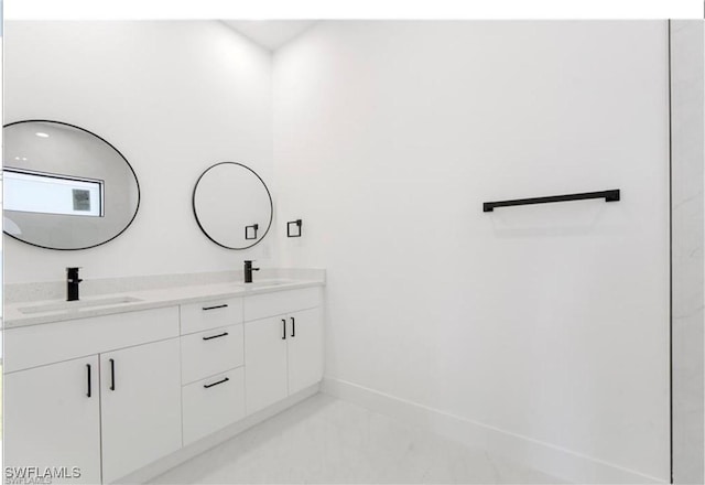 2815 32nd St W, Lehigh Acres, FL 33971 - full bath featuring double vanity and baseboards