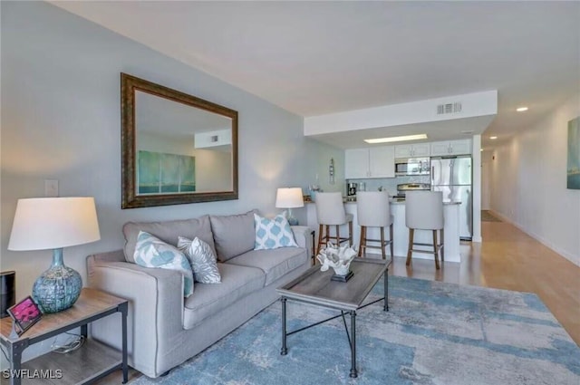 260 Southbay Dr Unit 103, Naples, FL 34108 - living area with baseboards