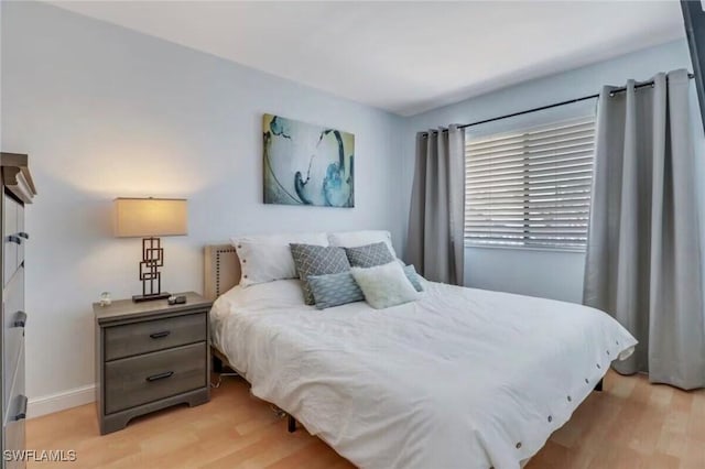 260 Southbay Dr Unit 103, Naples, FL 34108 - bedroom featuring light wood-style floors and baseboards