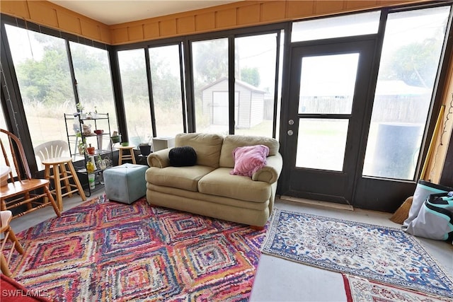sunroom featuring plenty of natural light and french doors