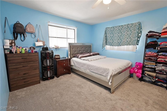 carpeted bedroom with a ceiling fan