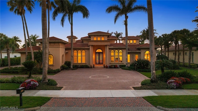 6387 Highcroft Dr, Naples, FL 34119 - mediterranean / spanish house with stucco siding and a tile roof