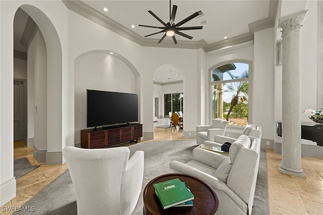 6387 Highcroft Dr, Naples, FL 34119 - living room with crown molding, arched walkways, recessed lighting, ornate columns, and a ceiling fan
