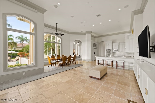 6387 Highcroft Dr, Naples, FL 34119 - living room featuring arched walkways, ornamental molding, a ceiling fan, baseboards, and recessed lighting