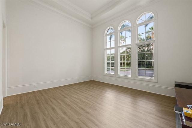 6387 Highcroft Dr, Naples, FL 34119 - empty room with ornamental molding, wood finished floors, and baseboards