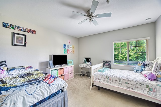 13160 Bella Casa Cir Unit 2115, Fort Myers, FL 33966 - bedroom featuring light colored carpet and a ceiling fan
