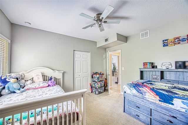 13160 Bella Casa Cir Unit 2115, Fort Myers, FL 33966 - bedroom with carpet, a textured ceiling, and ceiling fan