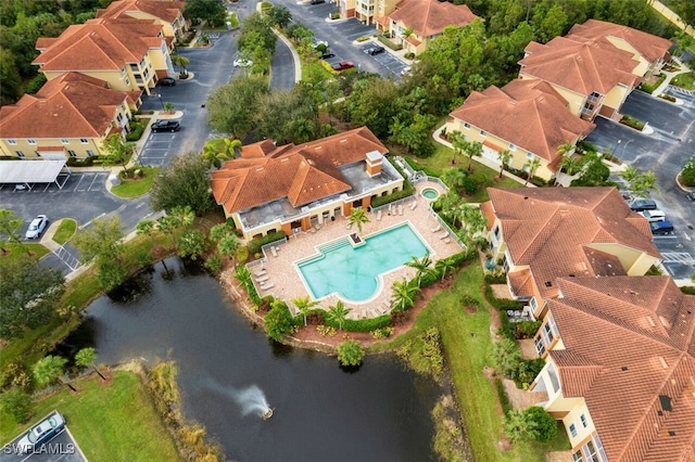 13160 Bella Casa Cir Unit 2115, Fort Myers, FL 33966 - drone / aerial view of a pool and a large body of water