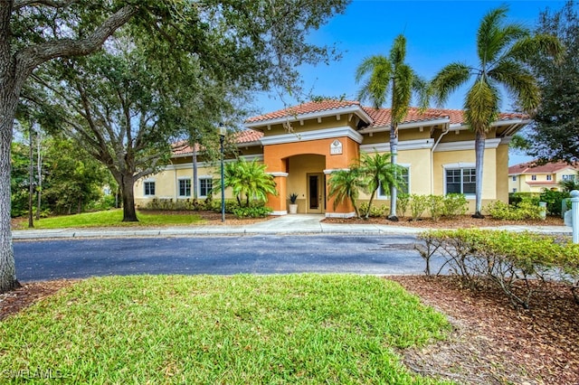 13160 Bella Casa Cir Unit 2115, Fort Myers, FL 33966 - mediterranean / spanish-style home with stucco siding and a tile roof