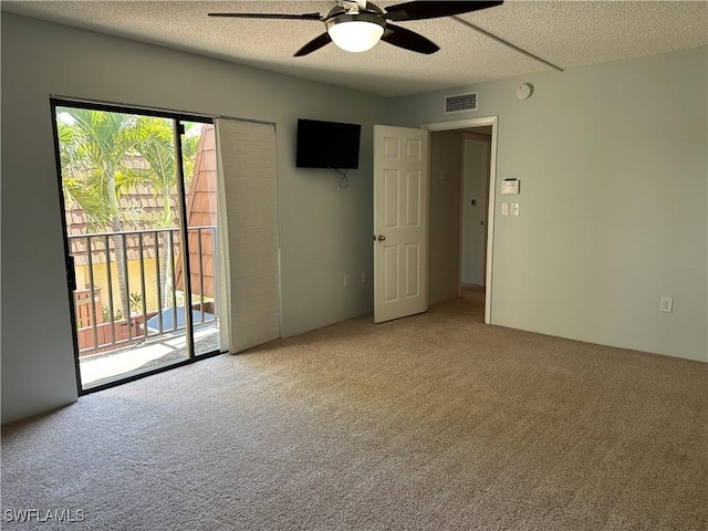 5226 Cedarbend Dr Unit 2, Fort Myers, FL 33919 - empty room featuring carpet flooring, ceiling fan, a textured ceiling, and a smoke detector