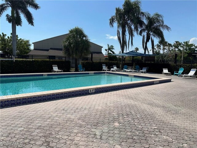 5226 Cedarbend Dr Unit 2, Fort Myers, FL 33919 - community pool with a patio area