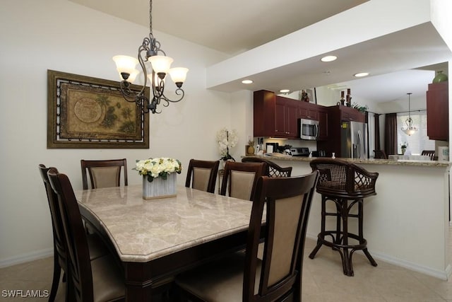 2386 Magnolia Ave Unit 7801, Naples, FL 34112 - dining room with a chandelier, baseboards, light tile patterned floors, recessed lighting, and vaulted ceiling