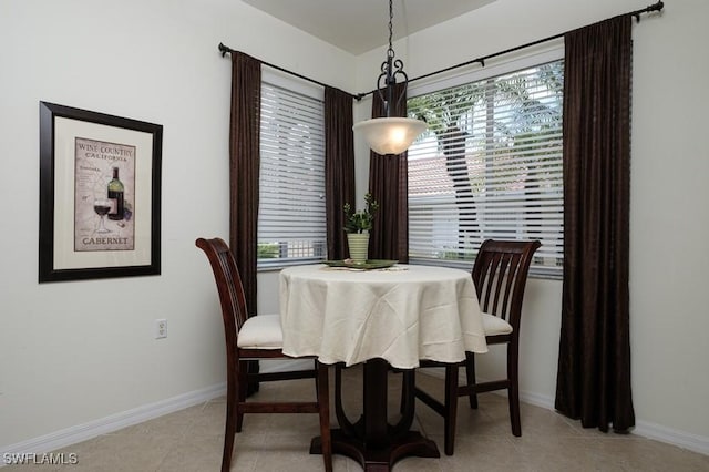 2386 Magnolia Ave Unit 7801, Naples, FL 34112 - dining space with baseboards and light tile patterned flooring