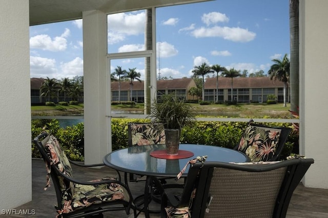 2386 Magnolia Ave Unit 7801, Naples, FL 34112 - sunroom / solarium featuring a water view