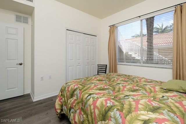 2386 Magnolia Ave Unit 7801, Naples, FL 34112 - bedroom featuring wood finished floors, a closet, and baseboards