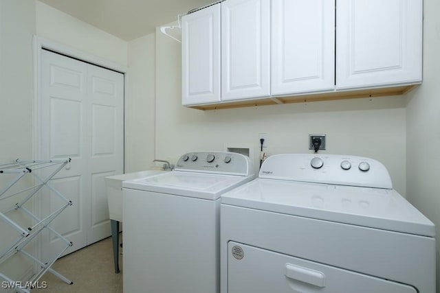 2386 Magnolia Ave Unit 7801, Naples, FL 34112 - clothes washing area with washer and dryer and cabinet space