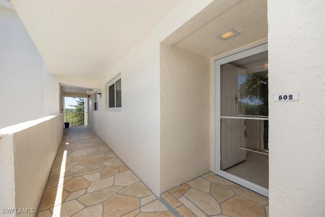 21 High Point Cir E Unit 502, Naples, FL 34103 - property entrance with stucco siding