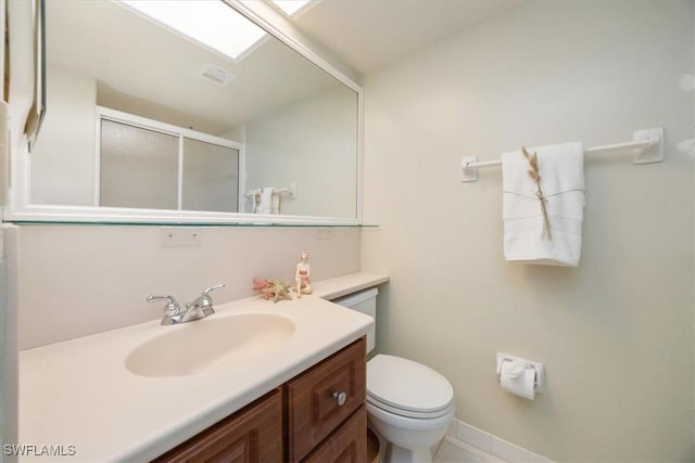 21 High Point Cir E Unit 502, Naples, FL 34103 - full bathroom featuring a stall shower, toilet, vanity, and baseboards