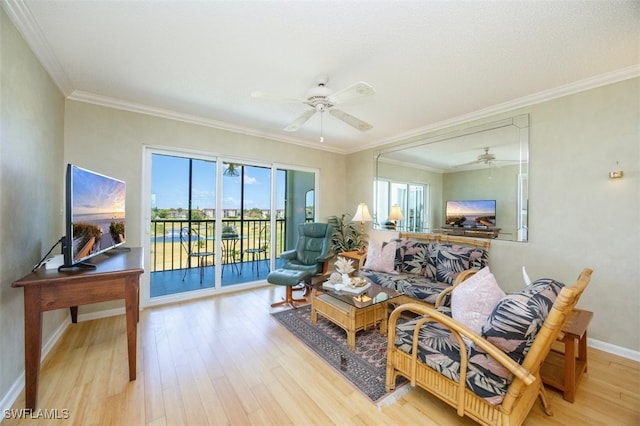 21 High Point Cir E Unit 502, Naples, FL 34103 - living room with ceiling fan, wood finished floors, ornamental molding, and baseboards
