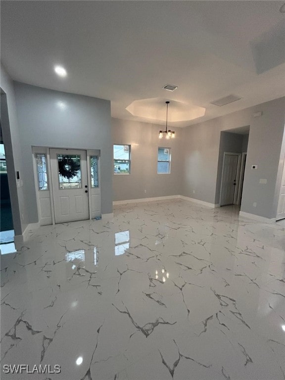 entryway featuring baseboards and light marble finish floors