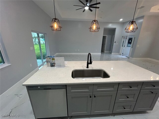 kitchen with dishwasher, a sink, open floor plan, and gray cabinetry