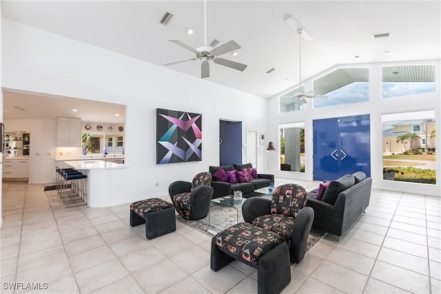 12439 Prather Ave, Port Charlotte, FL 33981 - living room featuring a ceiling fan, light tile patterned flooring, high vaulted ceiling, and recessed lighting