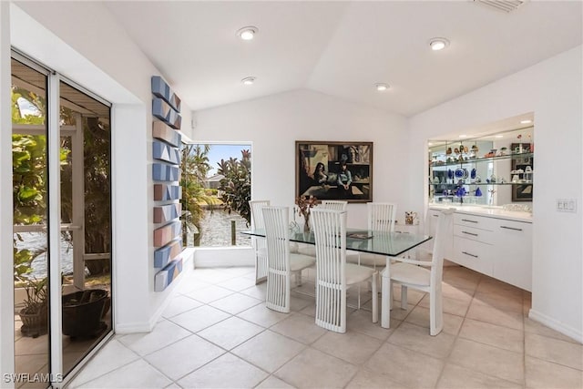 12439 Prather Ave, Port Charlotte, FL 33981 - dining area featuring vaulted ceiling and light tile patterned floors