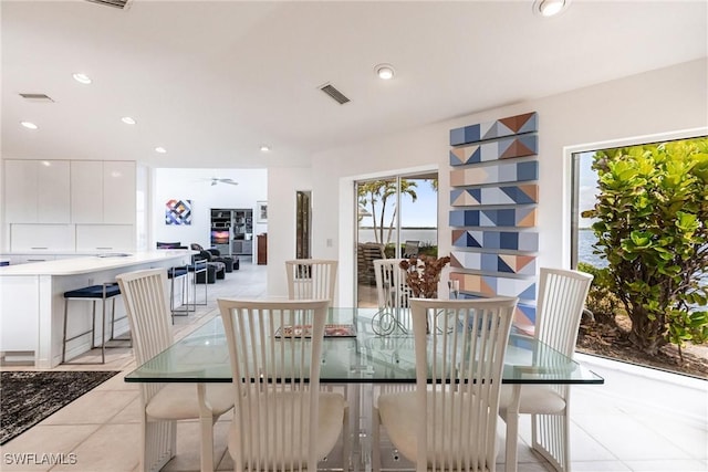 12439 Prather Ave, Port Charlotte, FL 33981 - dining room with light tile patterned floors, a ceiling fan, and recessed lighting