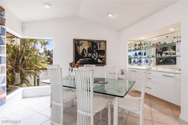 12439 Prather Ave, Port Charlotte, FL 33981 - dining space featuring light tile patterned flooring, vaulted ceiling, and recessed lighting