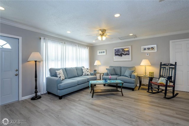 1303 Thompson St, North Fort Myers, FL 33903 - living area featuring a textured ceiling, light wood-style flooring, recessed lighting, crown molding, and ceiling fan