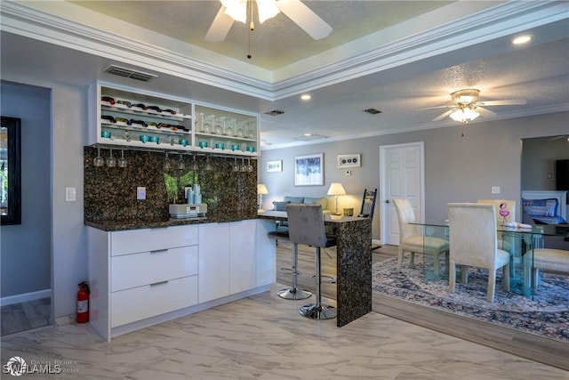 1303 Thompson St, North Fort Myers, FL 33903 - indoor bar with a ceiling fan, ornamental molding, light marble finish floors, backsplash, and recessed lighting