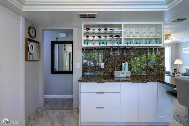 1303 Thompson St, North Fort Myers, FL 33903 - bar area featuring light marble finish floors, ornamental molding, baseboards, ceiling fan, and decorative backsplash