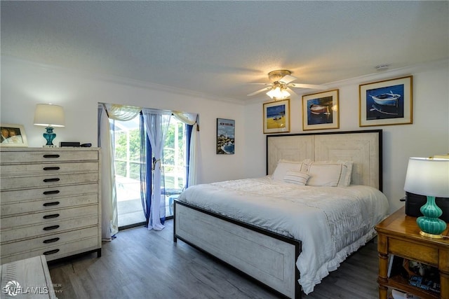 1303 Thompson St, North Fort Myers, FL 33903 - bedroom with access to outside, ornamental molding, wood finished floors, and a ceiling fan