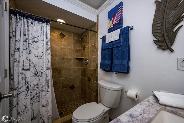 1303 Thompson St, North Fort Myers, FL 33903 - bathroom with tiled shower, toilet, and ornamental molding