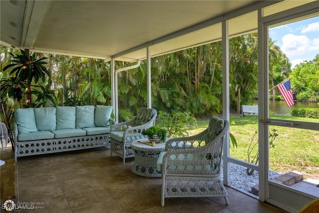 1303 Thompson St, North Fort Myers, FL 33903 - sunroom with healthy amount of natural light and a water view
