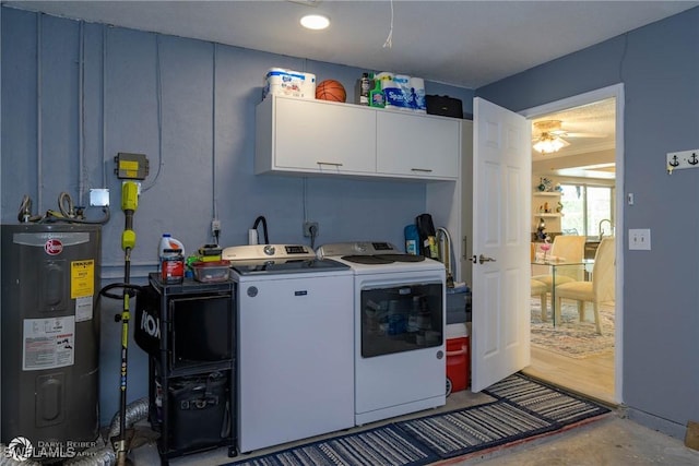 1303 Thompson St, North Fort Myers, FL 33903 - laundry area with water heater, washing machine and clothes dryer, cabinet space, and ceiling fan