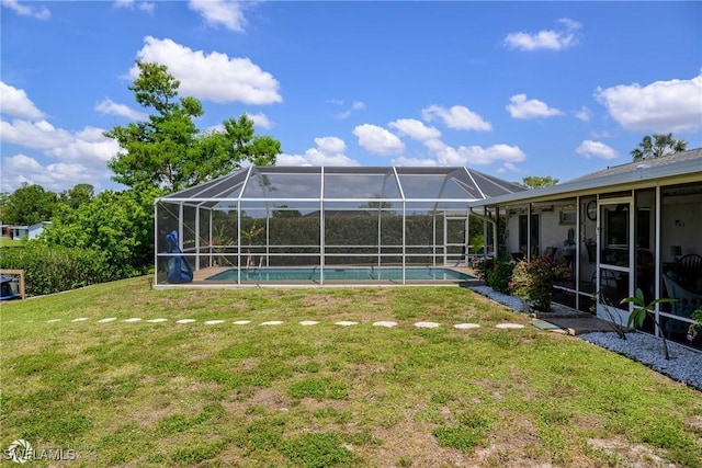 1303 Thompson St, North Fort Myers, FL 33903 - view of grassy yard featuring an outdoor pool