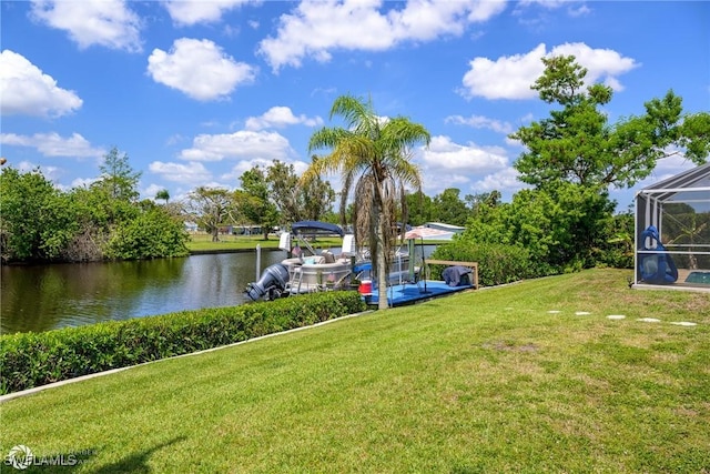 1303 Thompson St, North Fort Myers, FL 33903 - view of grassy yard with a water view and a lanai