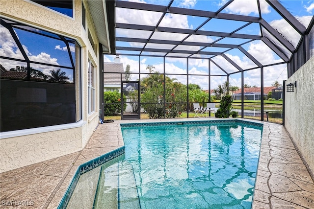 28839 Winthrop Cir, Bonita Springs, FL 34134 - outdoor pool featuring a patio area and glass enclosure