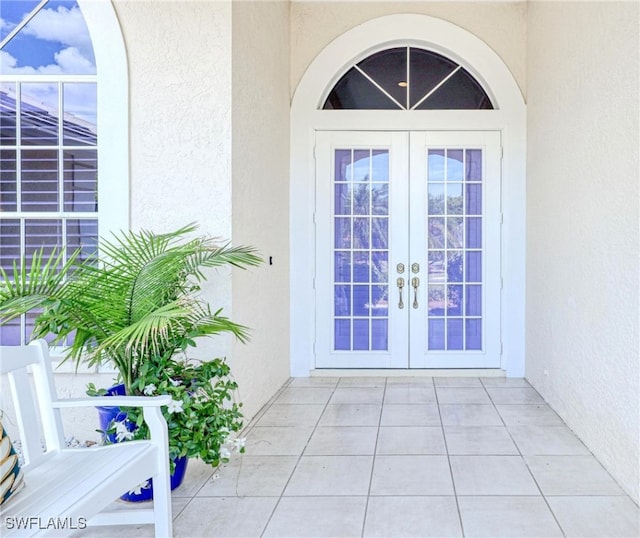 28839 Winthrop Cir, Bonita Springs, FL 34134 - property entrance featuring french doors and stucco siding
