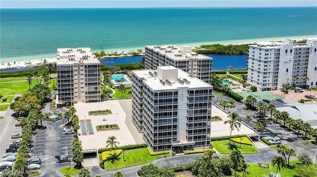 aerial view of a large body of water and apartment complex / building