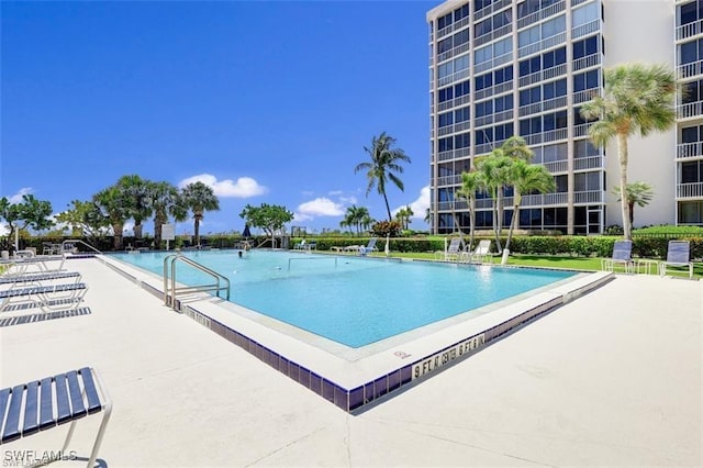 community pool featuring a patio area