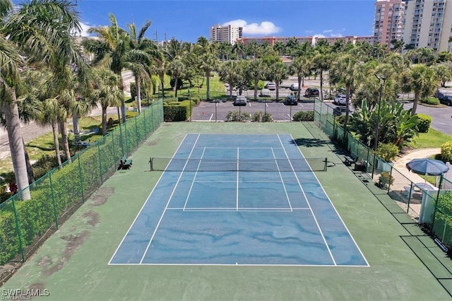view of tennis court with fence