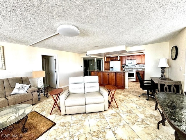 living area featuring a textured ceiling and light marble finish flooring