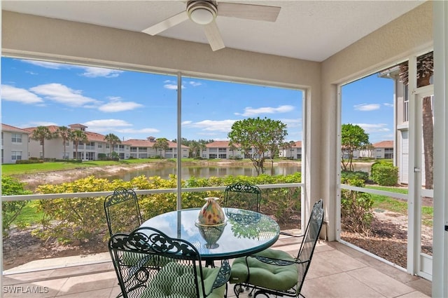 3045 Driftwood Way Unit 3707, Naples, FL 34109 - sunroom featuring ceiling fan, a water view, and tile patterned flooring
