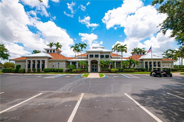 3045 Driftwood Way Unit 3707, Naples, FL 34109 - uncovered parking lot featuring french doors